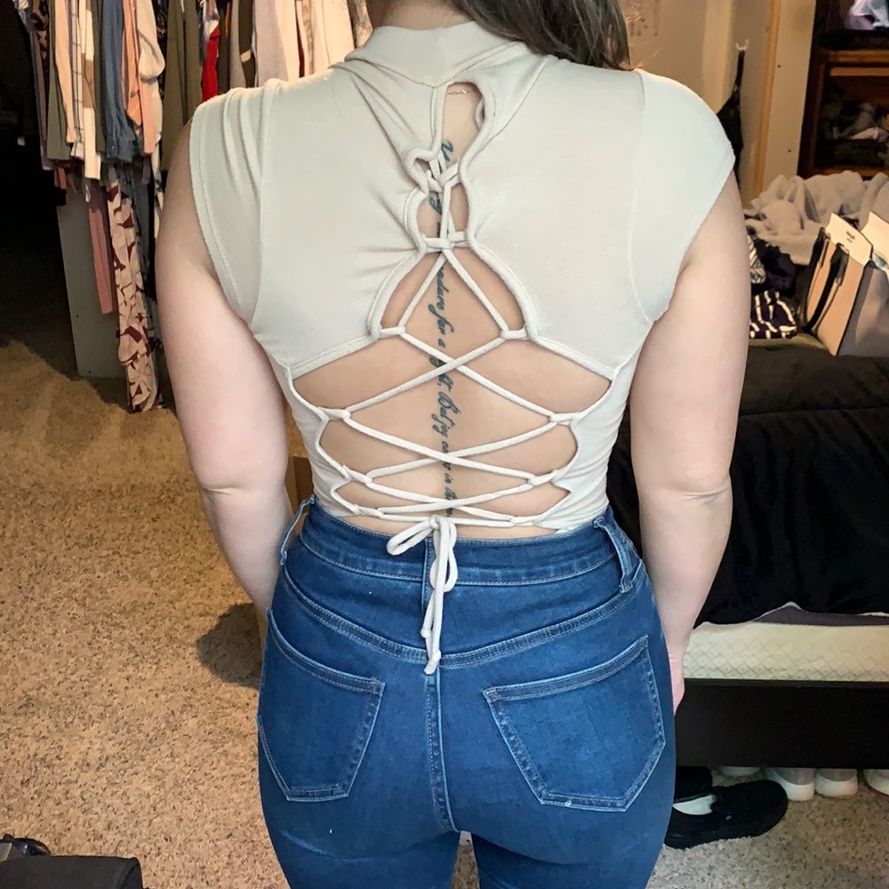Tan, stretchy, open back bodysuit